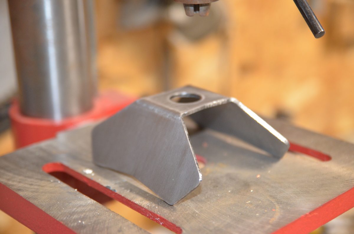 A Tetrapod under a drill press during fabrication